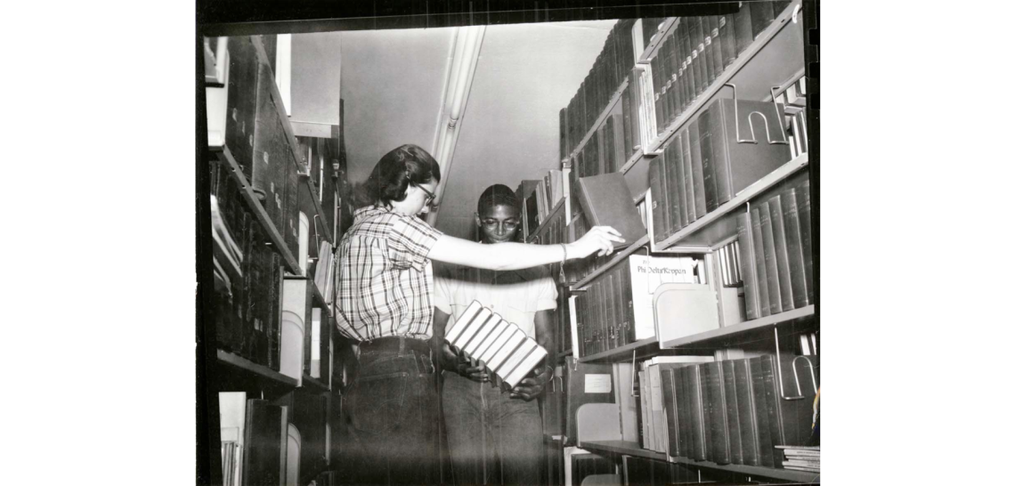 A black student and a white student in the UA Library, 1955