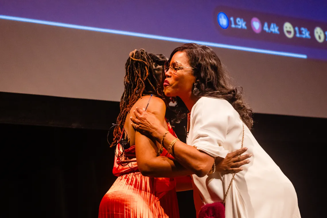 Two women embrace