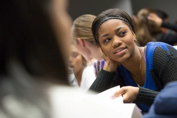 Black student working in a group class project.